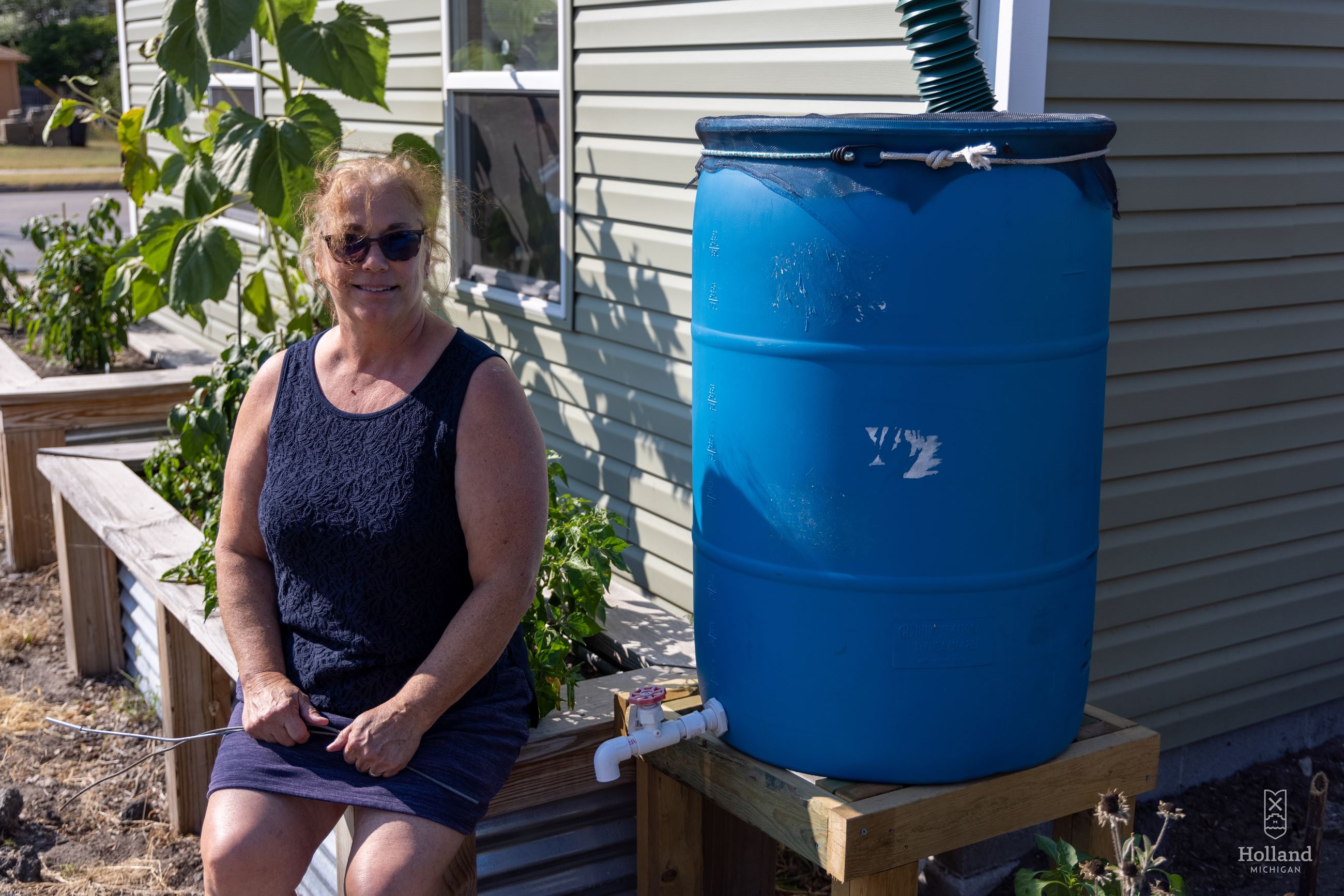 woman with rain barrel