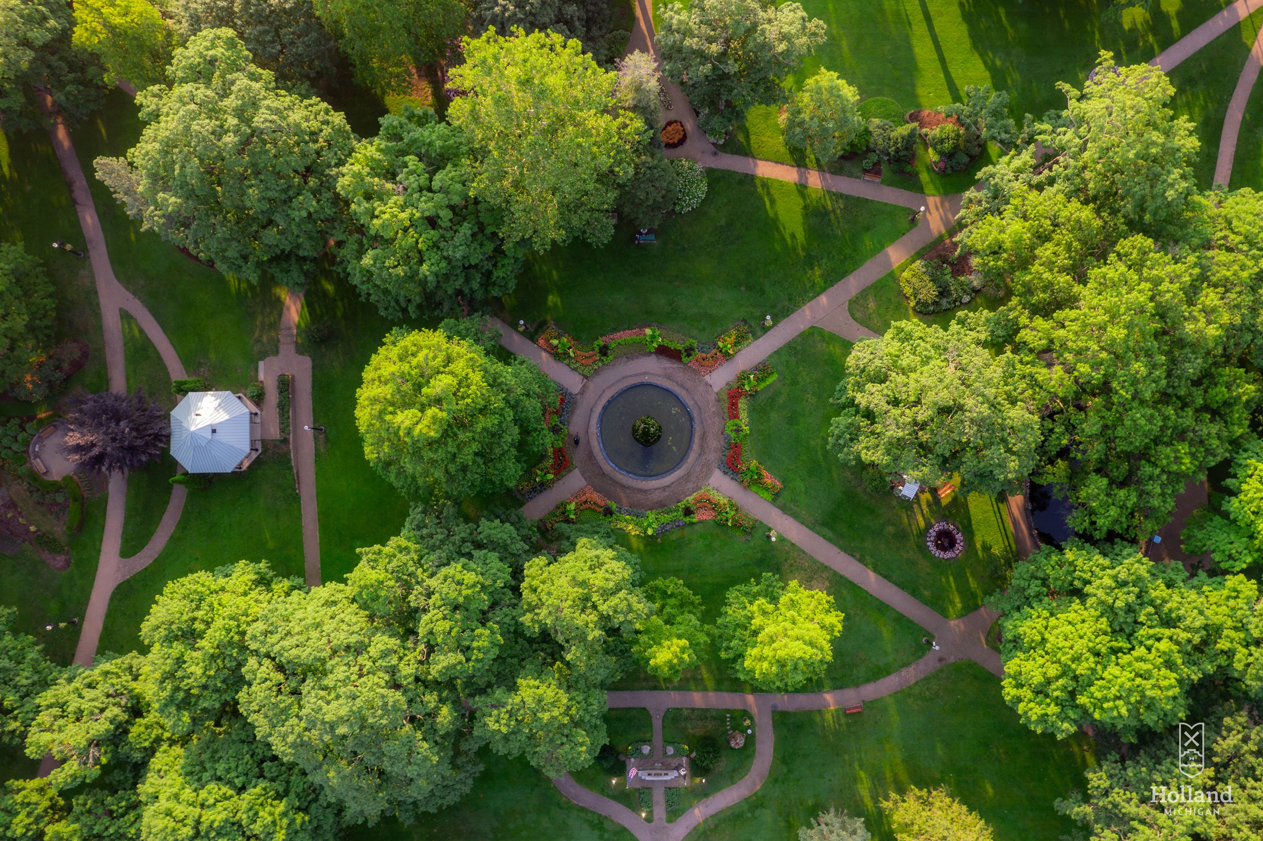 Ariel view of park with lots of green foliage and criss-cossing sidewalks
