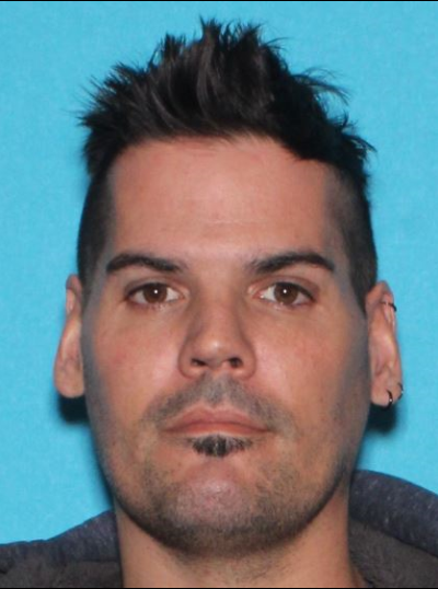 Male individual with dark hair