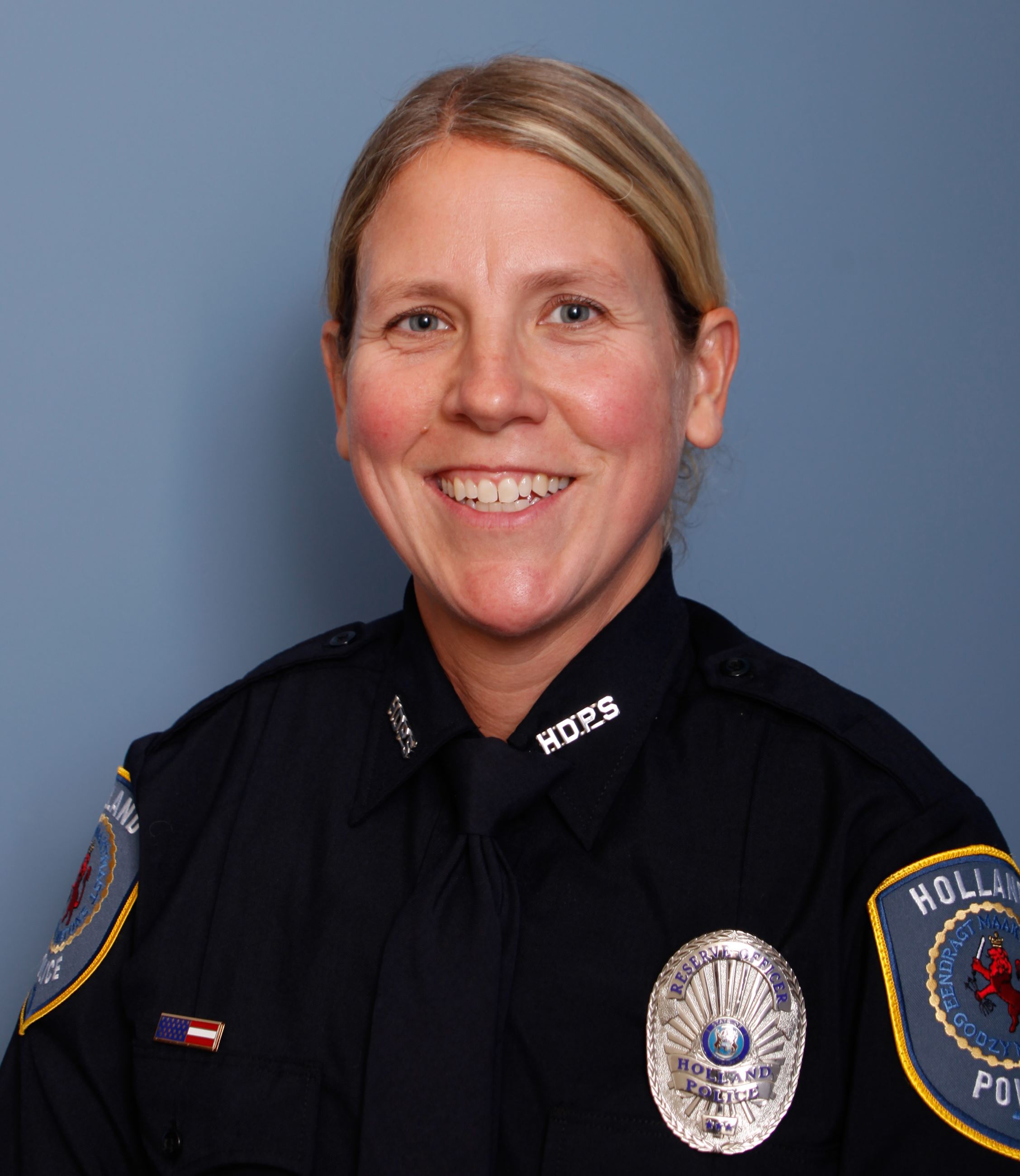 Head and shoulders of a female police officer in full uniform
