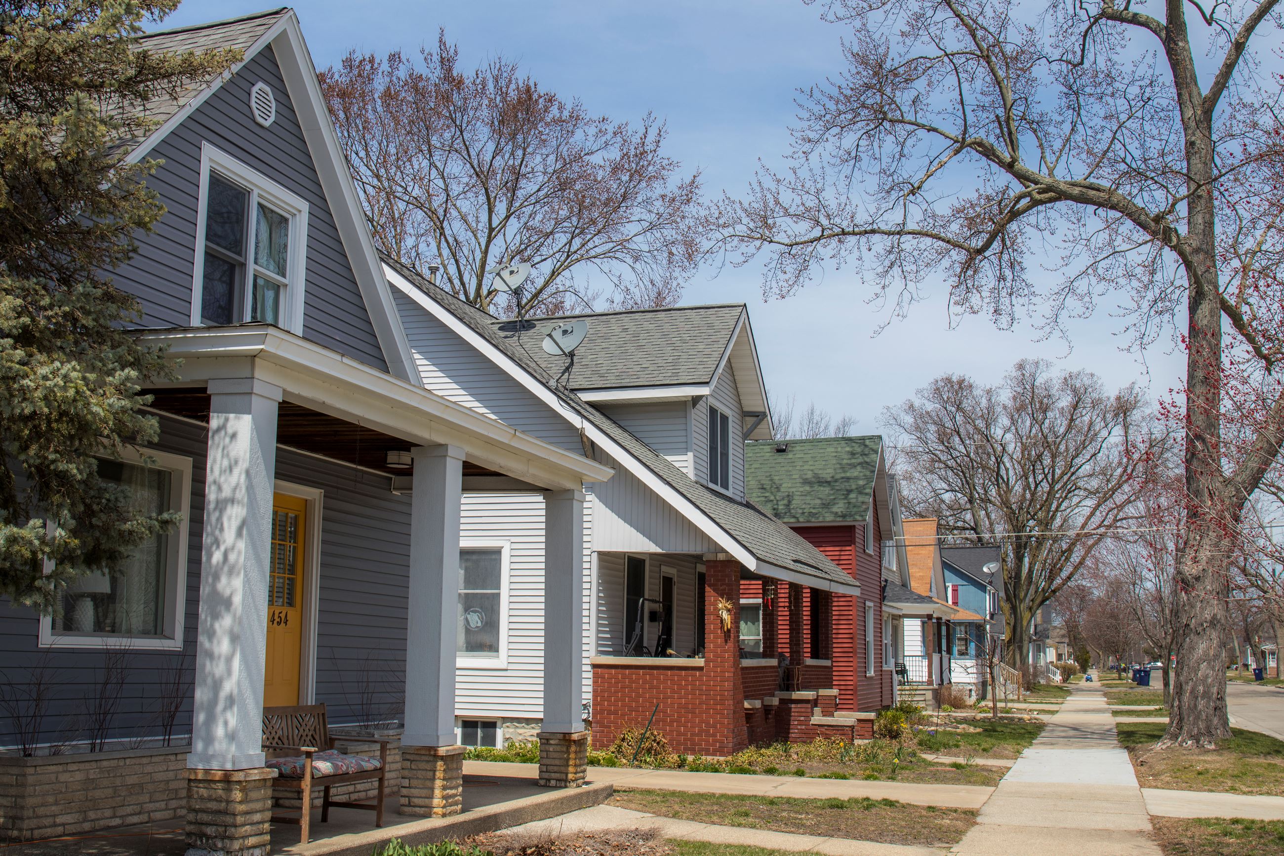 row of 2 story homes, on a small city street