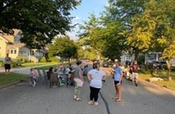 A group of people at a block party.